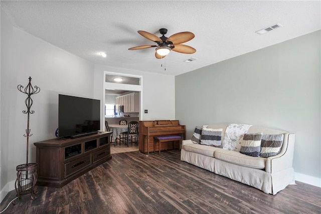 2254 9th St, Mandeville, LA 70471 - living room with a ceiling fan, wood finished floors, and baseboards