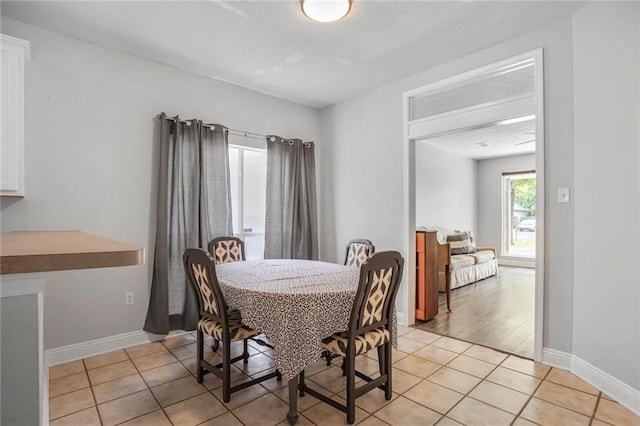 2254 9th St, Mandeville, LA 70471 - dining space with light tile patterned floors and baseboards
