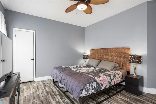 2254 9th St, Mandeville, LA 70471 - bedroom with wood finished floors, baseboards, and ceiling fan