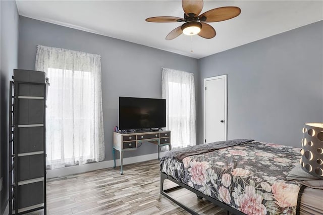 2254 9th St, Mandeville, LA 70471 - bedroom with wood finished floors and ceiling fan