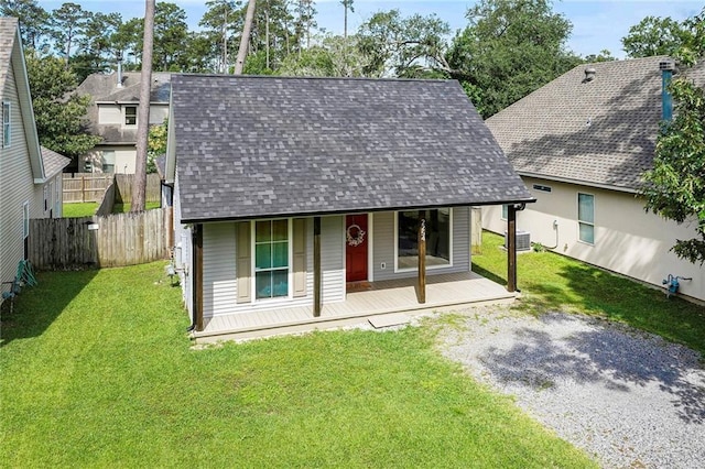 2254 9th St, Mandeville, LA 70471 - view of front facade with a shingled roof, central air condition unit, and a porch