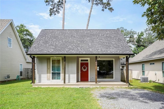 2254 9th St, Mandeville, LA 70471 - view of front of property with central AC, roof with shingles, and a porch