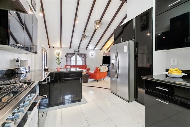kitchen with range, dark cabinets, beam ceiling, a peninsula, and stainless steel fridge with ice dispenser