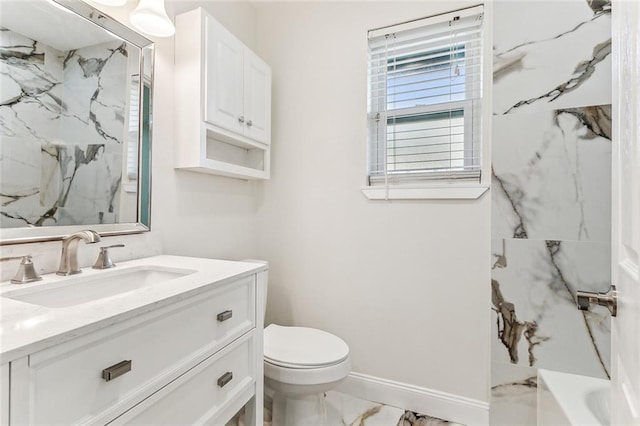 745 Oaklawn Dr, Metairie, LA 70005 - bathroom with marble finish floors, vanity, toilet, and baseboards