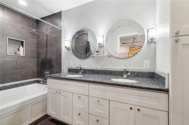 535 Amethyst St, New Orleans, LA 70124 - bathroom with double vanity, a sink, and shower / bathing tub combination