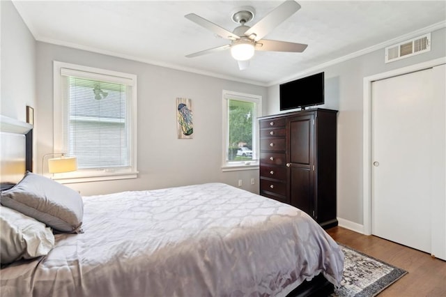 535 Amethyst St, New Orleans, LA 70124 - bedroom with visible vents, ornamental molding, and wood finished floors