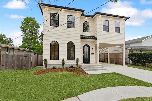 3117 41st St, Metairie, LA 70001 - view of front of house featuring concrete driveway, a carport, a standing seam roof, and a metal roof