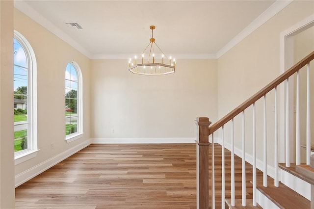 3117 41st St, Metairie, LA 70001 - entrance foyer featuring a chandelier, light wood-style floors, stairway, and ornamental molding