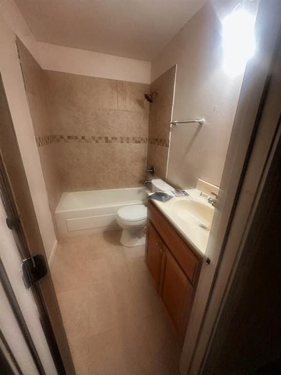 bathroom with vanity, tile patterned floors, bathtub / shower combination, and toilet