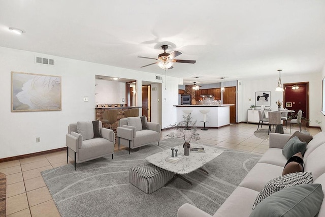 18 Landsdowne Ln, Destrehan, LA 70047 - living room with baseboards, visible vents, light tile patterned floors, and ceiling fan