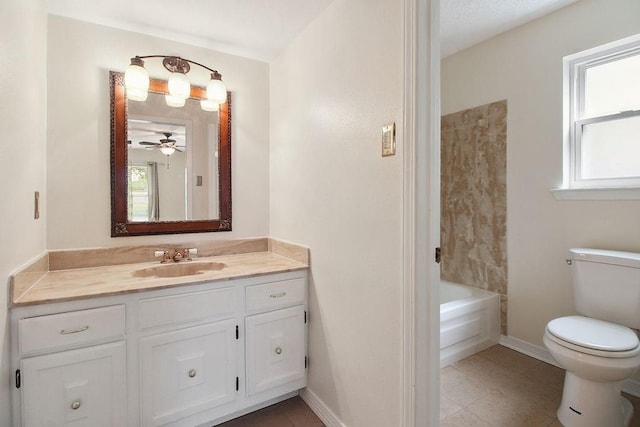 18 Landsdowne Ln, Destrehan, LA 70047 - bathroom featuring toilet, a ceiling fan, vanity, and plenty of natural light
