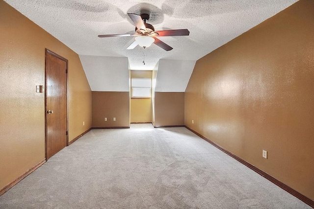 18 Landsdowne Ln, Destrehan, LA 70047 - additional living space with a ceiling fan, baseboards, light carpet, and a textured ceiling