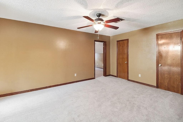 18 Landsdowne Ln, Destrehan, LA 70047 - unfurnished bedroom with visible vents, ceiling fan, light carpet, and baseboards