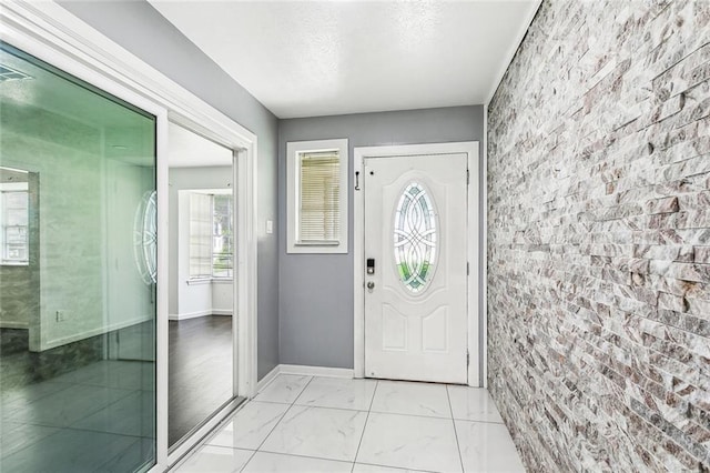 2140 Carol Sue Ave, Terrytown, LA 70056 - foyer with marble finish floor, baseboards, and plenty of natural light