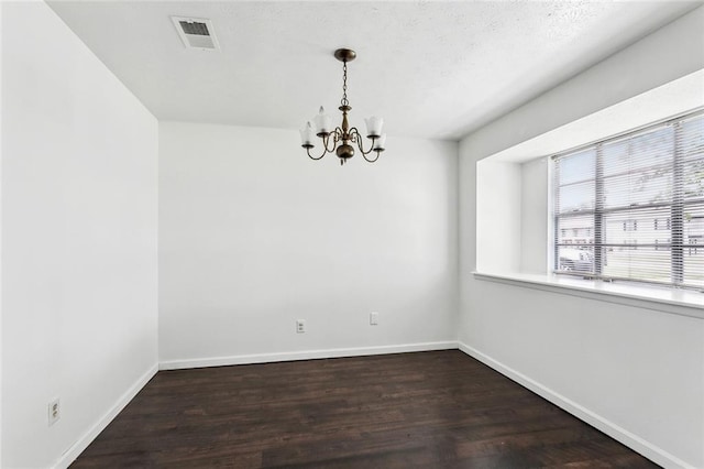 2140 Carol Sue Ave, Terrytown, LA 70056 - unfurnished room featuring visible vents, a notable chandelier, dark wood-style floors, and baseboards