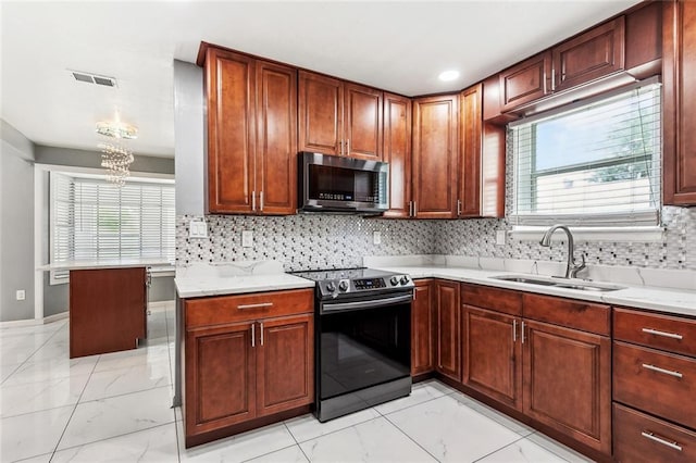2140 Carol Sue Ave, Terrytown, LA 70056 - kitchen with visible vents, marble finish floor, appliances with stainless steel finishes, and a sink
