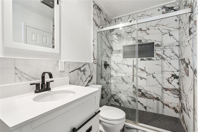 2140 Carol Sue Ave, Terrytown, LA 70056 - full bathroom featuring tile walls, a marble finish shower, toilet, and vanity