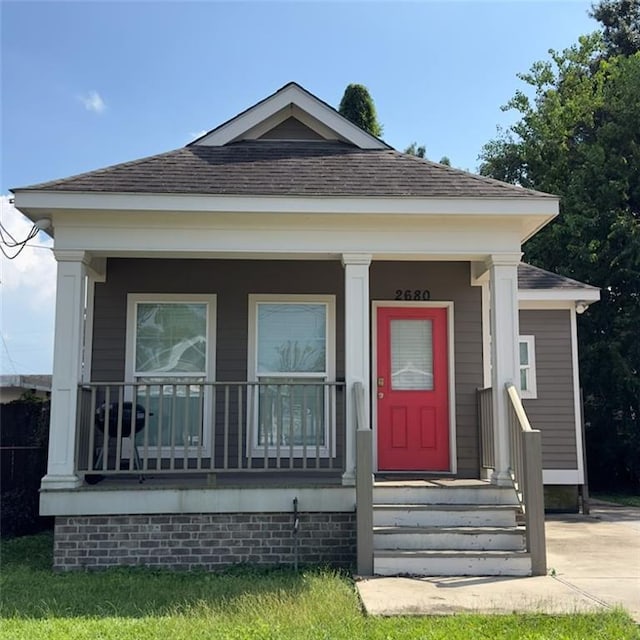 2680 Lavender St, New Orleans, LA 70122 - view of front of house featuring covered porch and roof with shingles