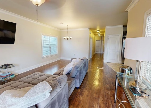 2680 Lavender St, New Orleans, LA 70122 - living area with wood finished floors, crown molding, and a chandelier