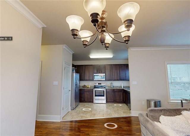 2680 Lavender St, New Orleans, LA 70122 - kitchen featuring appliances with stainless steel finishes, crown molding, light wood-style floors, a chandelier, and dark brown cabinets