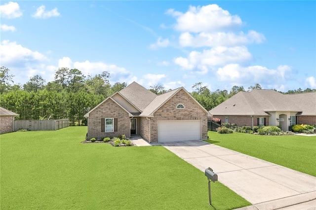 28230 Loiret Ct, Ponchatoula, LA 70454 - view of front of home featuring a garage, driveway, and brick siding