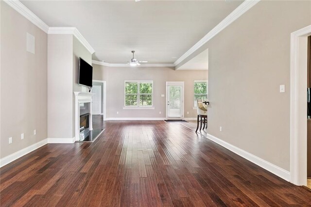 28230 Loiret Ct, Ponchatoula, LA 70454 - unfurnished living room with a ceiling fan, dark wood-type flooring, a fireplace, and ornamental molding