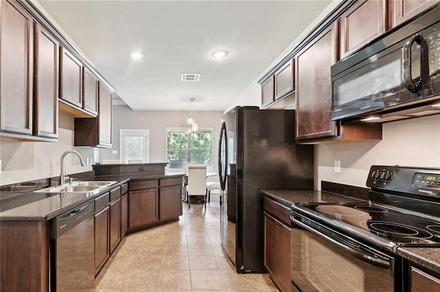 28230 Loiret Ct, Ponchatoula, LA 70454 - kitchen featuring black appliances, dark stone counters, light tile patterned floors, dark brown cabinets, and pendant lighting