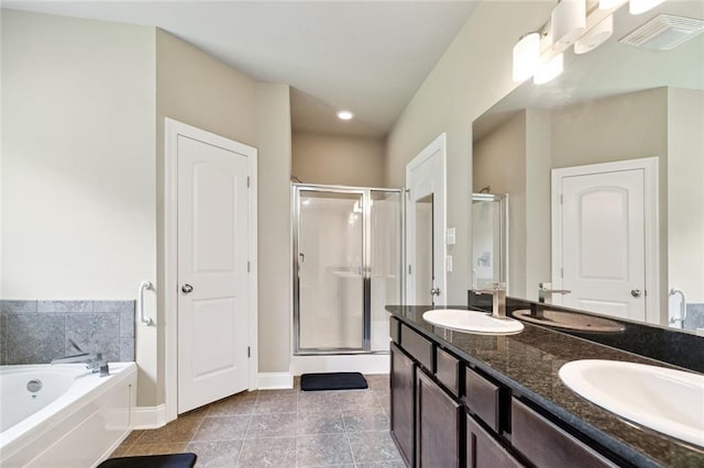 28230 Loiret Ct, Ponchatoula, LA 70454 - bathroom with a stall shower, double vanity, a garden tub, tile patterned flooring, and recessed lighting