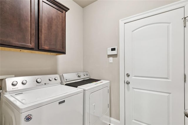 28230 Loiret Ct, Ponchatoula, LA 70454 - laundry area featuring washing machine and clothes dryer and cabinet space
