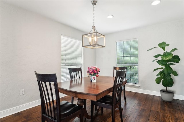 dining area with hardwood / wood-style floors, a notable chandelier, recessed lighting, and baseboards