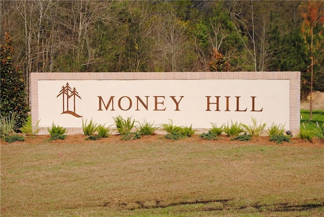 community / neighborhood sign with a lawn