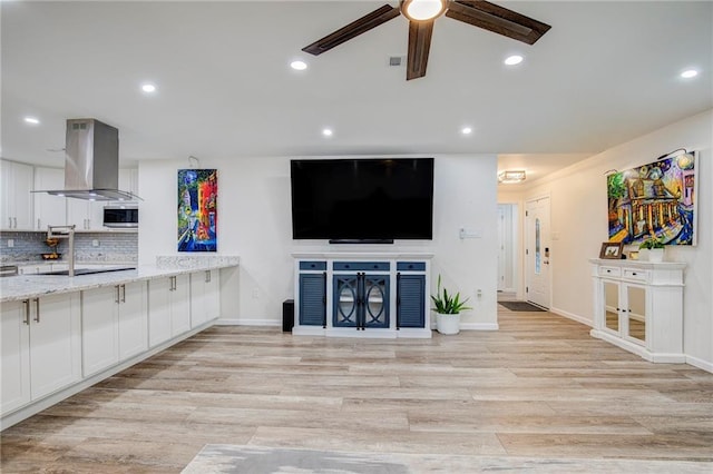 208 Bedford St, La Place, LA 70068 - unfurnished living room featuring ceiling fan, light wood-type flooring, recessed lighting, and baseboards
