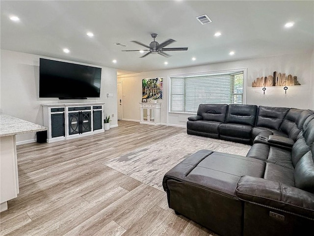 208 Bedford St, La Place, LA 70068 - living room featuring ceiling fan, light wood-style floors, recessed lighting, and baseboards