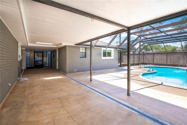 208 Bedford St, La Place, LA 70068 - view of swimming pool featuring a patio area and glass enclosure