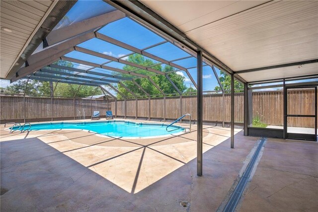 208 Bedford St, La Place, LA 70068 - view of swimming pool with a patio area, a fenced backyard, and glass enclosure