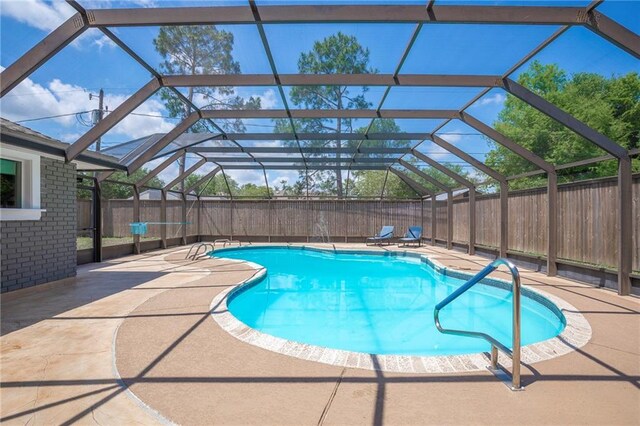208 Bedford St, La Place, LA 70068 - view of swimming pool featuring a fenced backyard, a patio, and glass enclosure