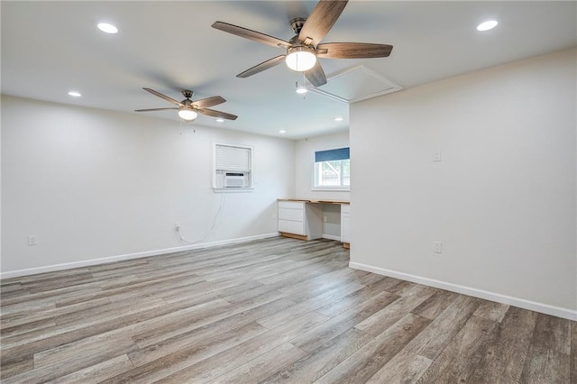 208 Bedford St, La Place, LA 70068 - unfurnished living room featuring attic access, ceiling fan, light wood-type flooring, baseboards, and cooling unit