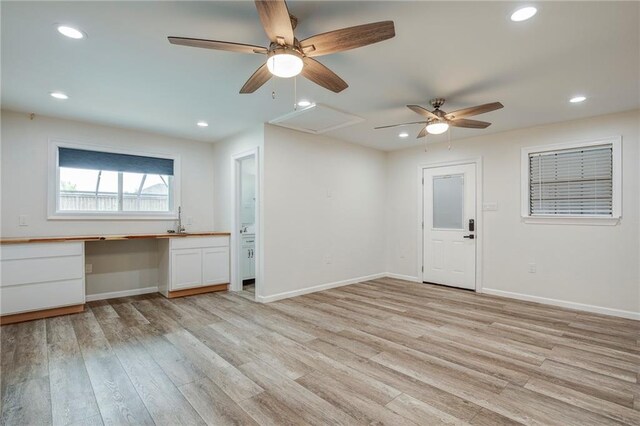 208 Bedford St, La Place, LA 70068 - unfurnished living room featuring a ceiling fan, light wood-style floors, baseboards, a sink, and recessed lighting