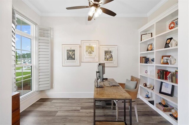 office featuring crown molding, ceiling fan, wood finished floors, and baseboards