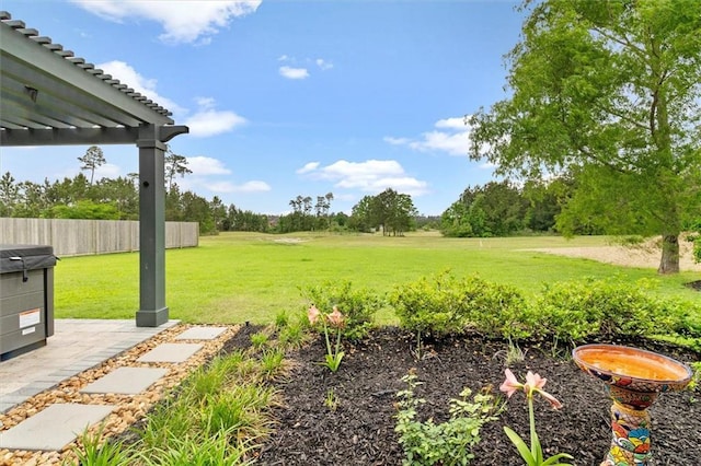 view of yard featuring a pergola and fence