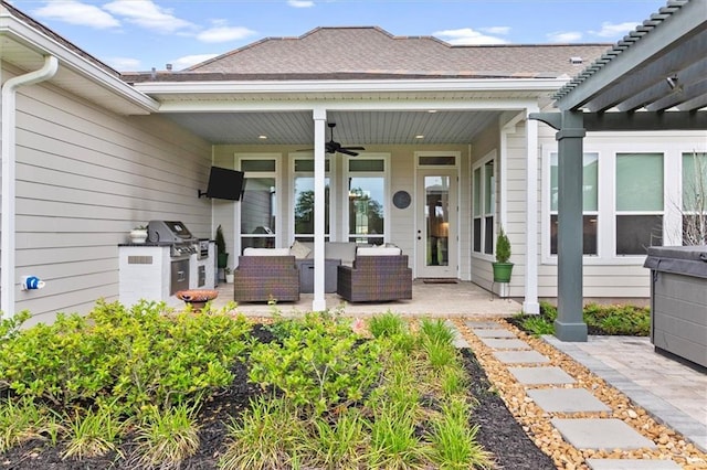 exterior space featuring a pergola, a patio area, an outdoor living space, exterior kitchen, and a ceiling fan