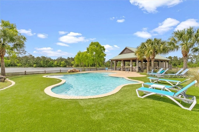 pool featuring a lawn, a patio, a gazebo, and fence