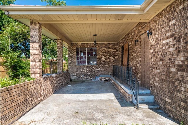 view of patio / terrace featuring fence