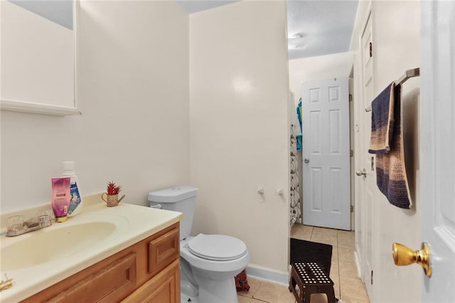 bathroom featuring a shower with shower curtain, toilet, tile patterned flooring, and vanity