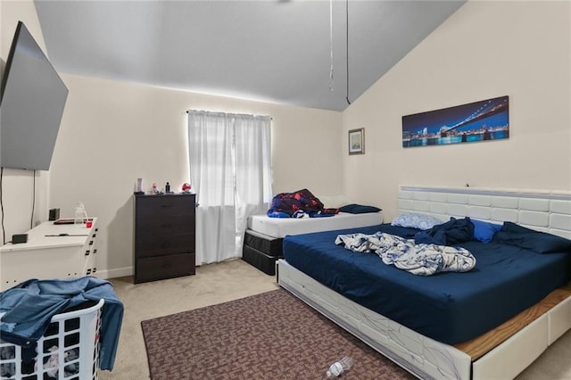 carpeted bedroom with vaulted ceiling