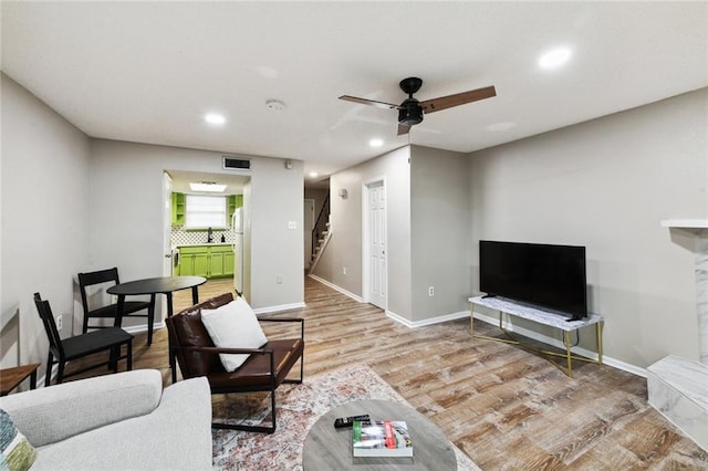 2628 Lepage St Unit 2628, New Orleans, LA 70119 - living room with a ceiling fan, recessed lighting, visible vents, wood finished floors, and stairway
