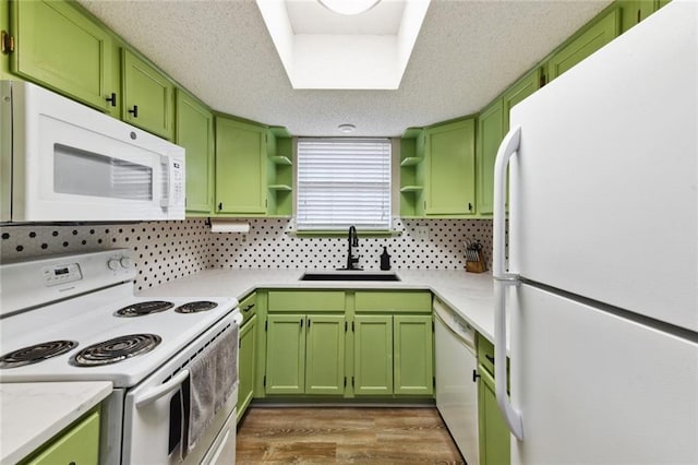 2628 Lepage St Unit 2628, New Orleans, LA 70119 - kitchen featuring a sink, open shelves, white appliances, and green cabinetry