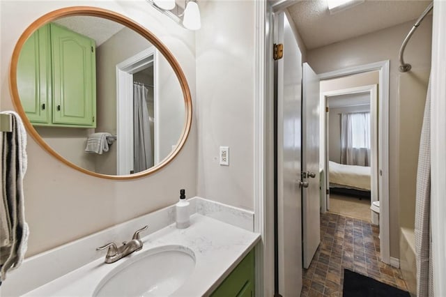 2628 Lepage St Unit 2628, New Orleans, LA 70119 - full bath featuring vanity, a textured ceiling, a shower with shower curtain, and baseboards
