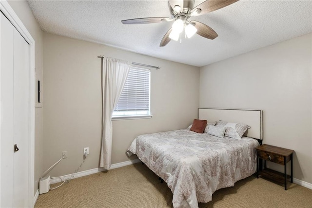2628 Lepage St Unit 2628, New Orleans, LA 70119 - bedroom with a textured ceiling, baseboards, and carpet floors