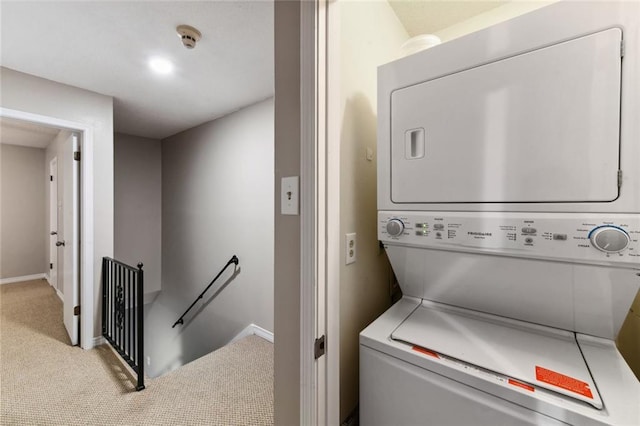 2628 Lepage St Unit 2628, New Orleans, LA 70119 - laundry area featuring stacked washer and clothes dryer, laundry area, baseboards, and light colored carpet